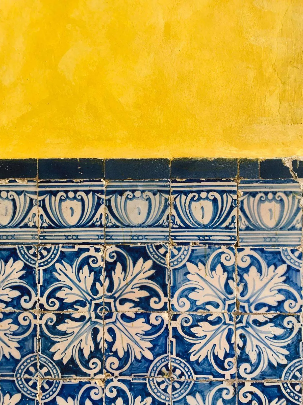 Close-up of ornate blue and white tiles with floral motifs.