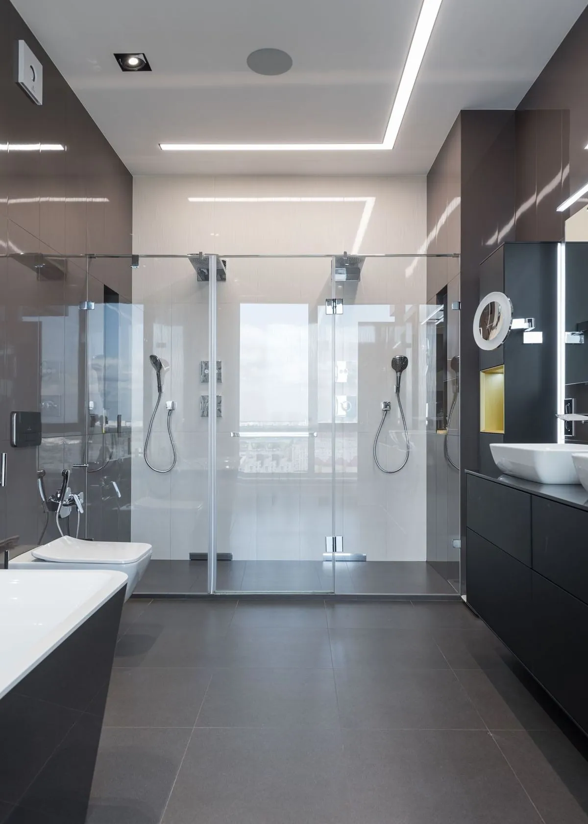 Stylish contemporary bathroom with a sleek glass shower and elegant fixtures.