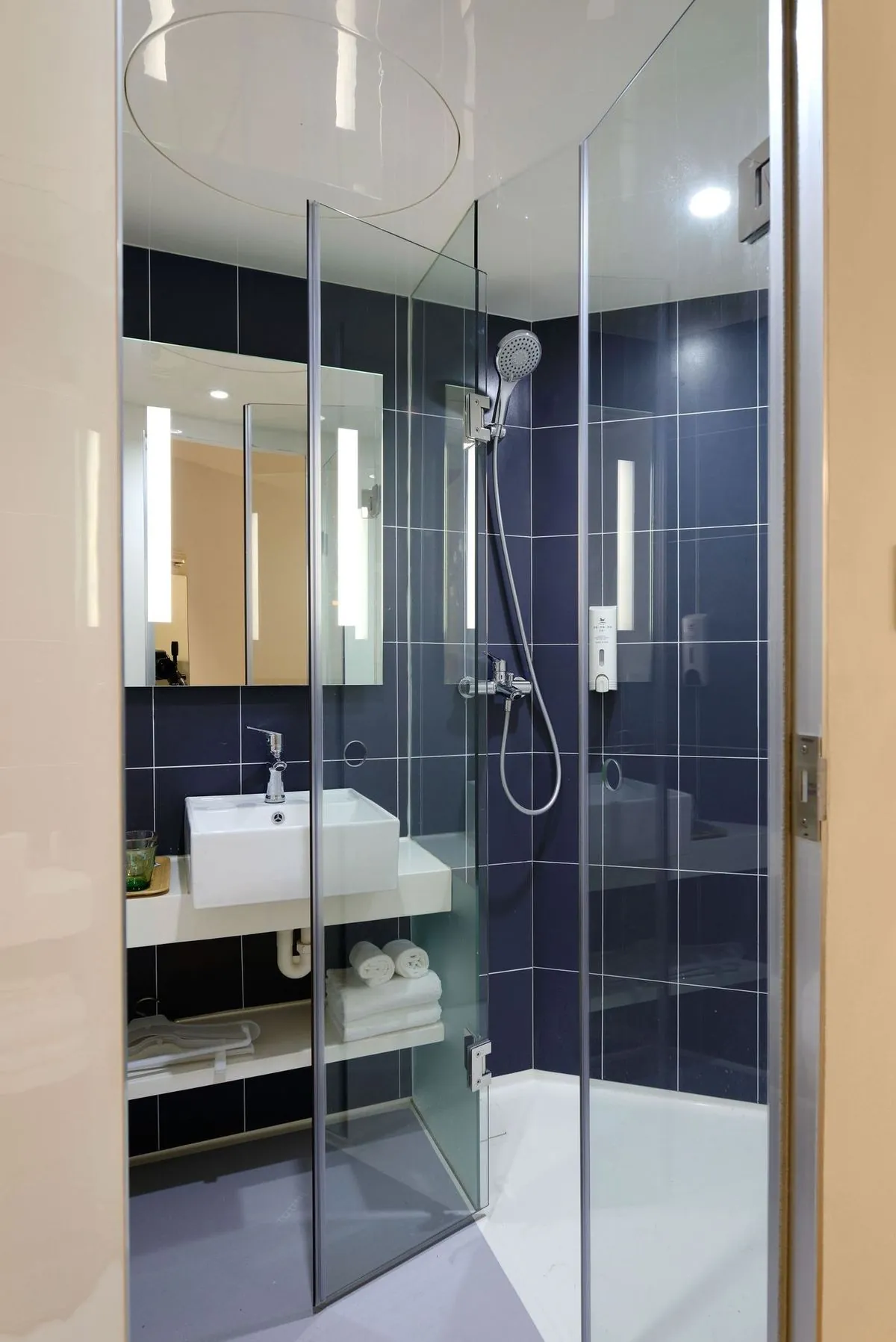 Modern bathroom with a clear glass shower and contemporary design.