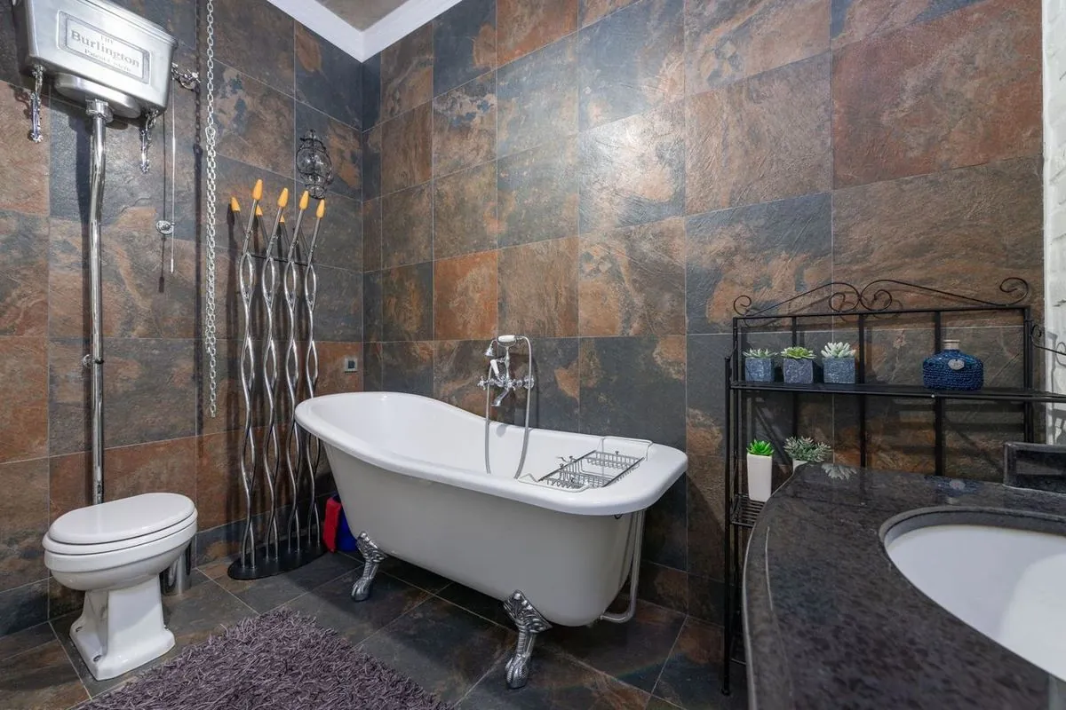 Classic bathroom interior with a vintage-style clawfoot bathtub