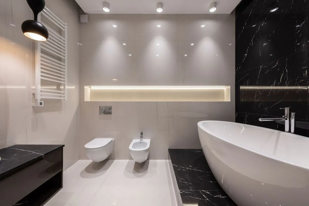 Stylish bathroom interior with contrasting black and white tile