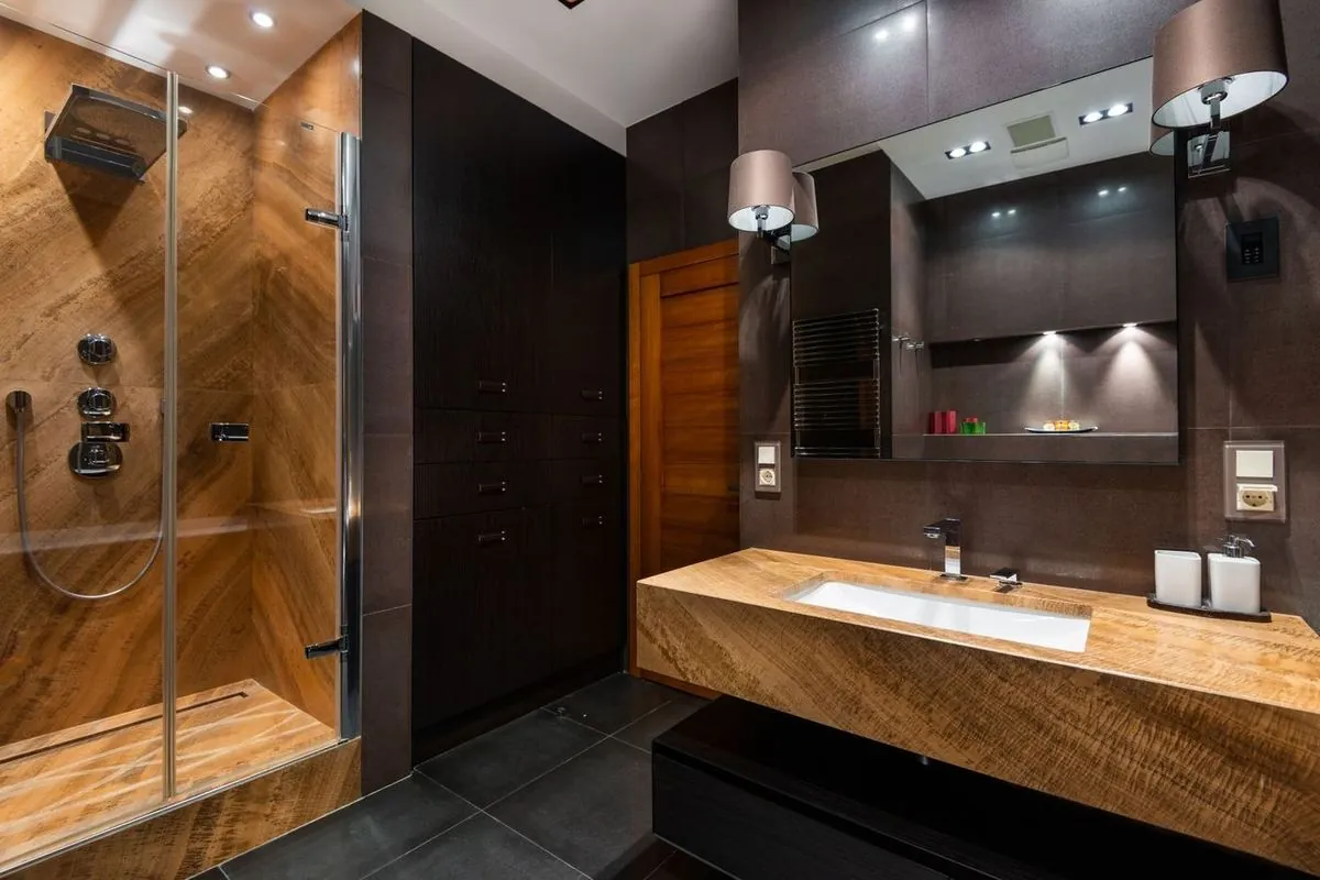 Modern bathroom interior with wooden accents and contemporary fixtures.