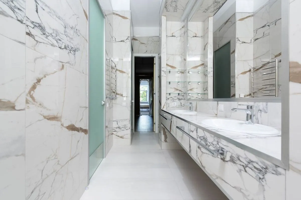 Elegant marble bathroom featuring a modern double vanity design