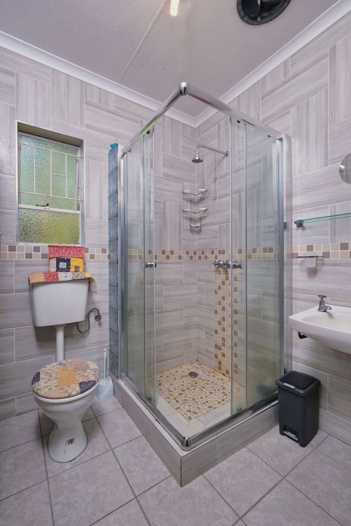 Modern bathroom with glass shower enclosure