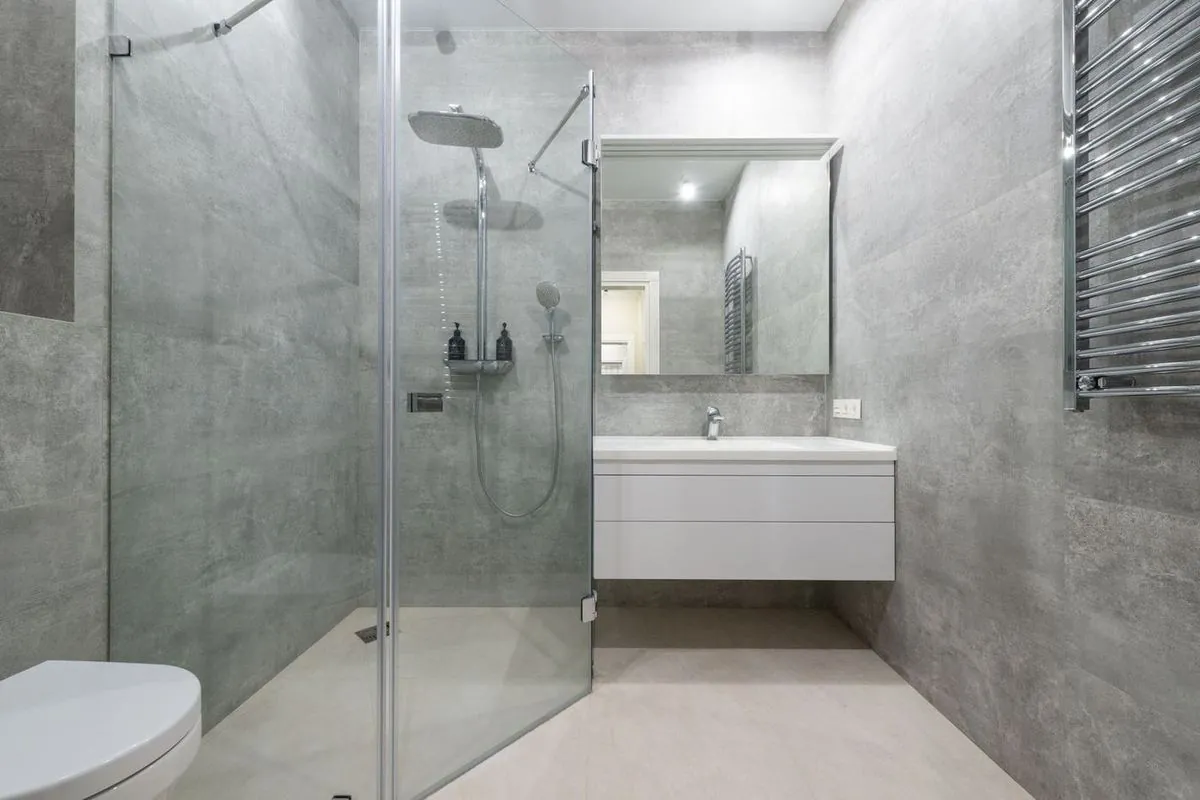 Stylish modern bathroom with a glass shower and minimal decor